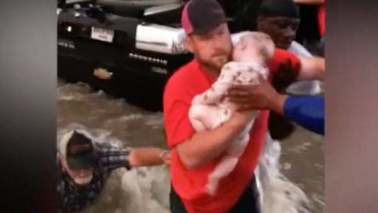   
																'Dear Jesus, please let this baby breathe': Incredible moment a Texas family is rescued from a flood 
															 