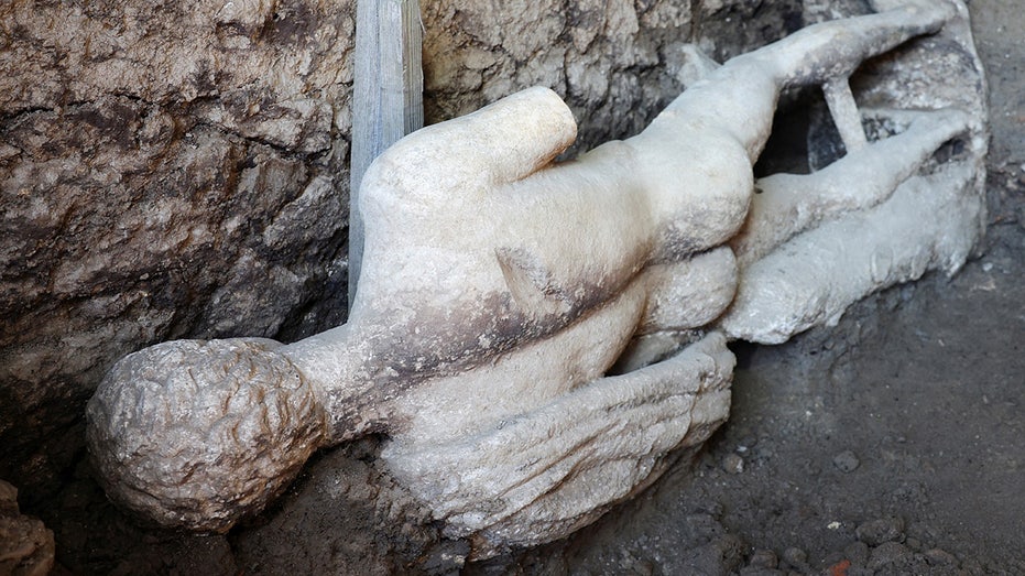  Statue of Greek god uncovered by archaeologists during excavation of ancient Roman sewer in Bulgaria 