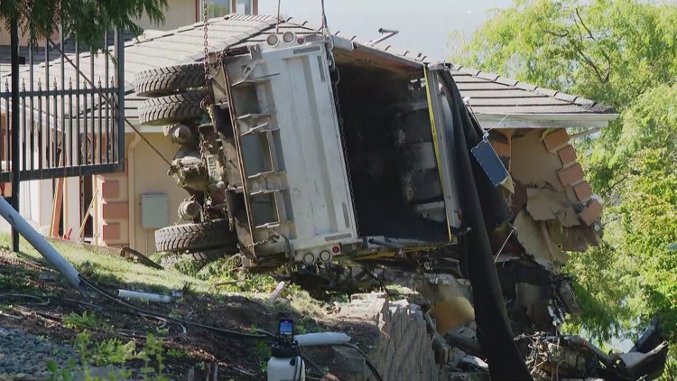  Driver hospitalized after dump truck crashes into Edmonds home 