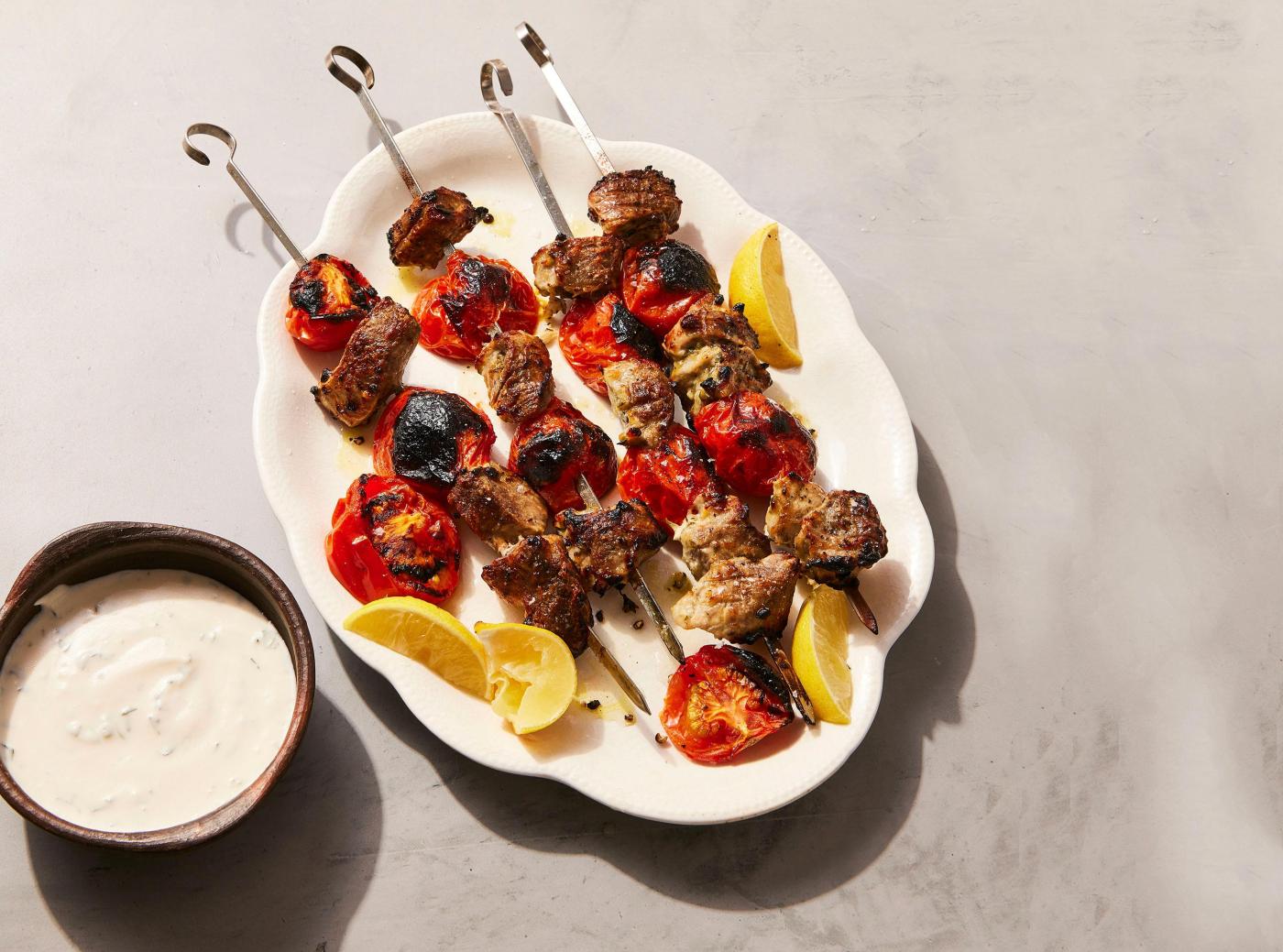  A garlicky yogurt marinade pulls double duty in souvlaki-inspired pork skewers 