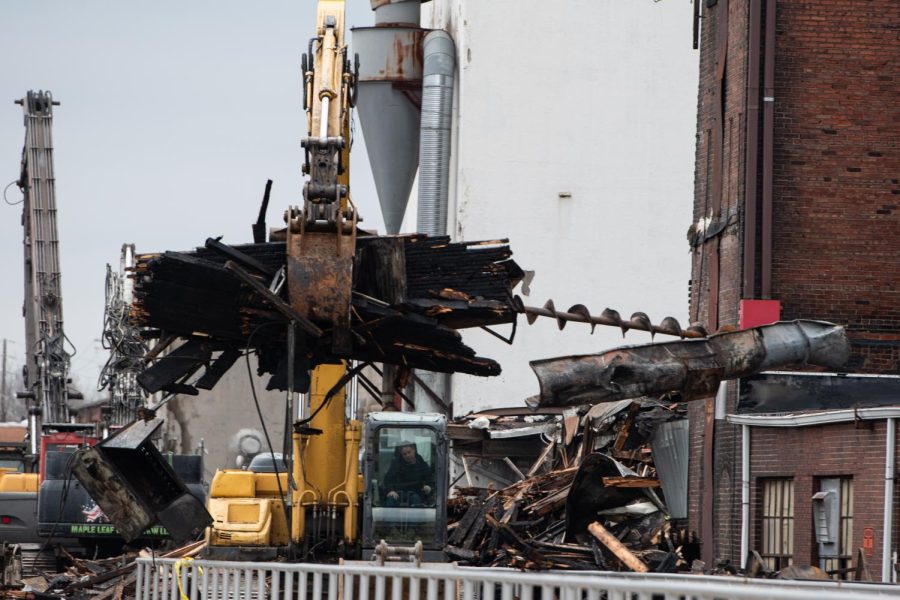   
																Crews clear debris as community mourns loss of downtown landmark 
															 