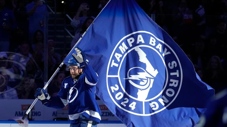  Power company workers get a standing ovation during the Lightning's hurricane-delayed home opener 