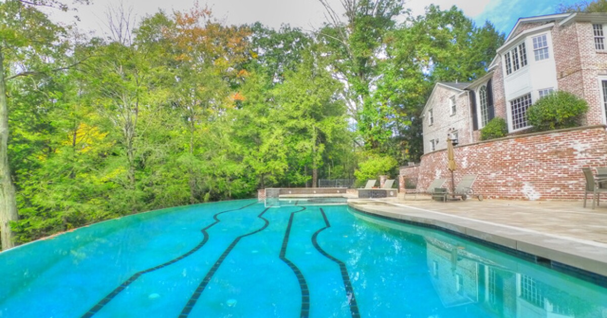  
																PHOTOS: This incredible $4.9 million home in Hunting Valley has an infinity pool, tennis court 
															 