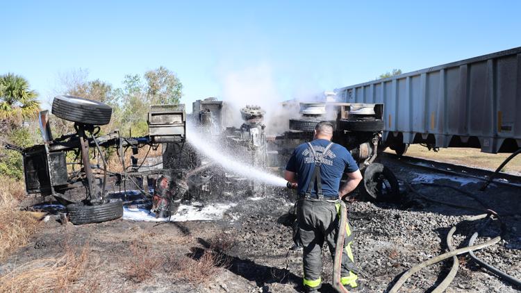  1 dead after dump truck and train collide, burst into flames, Hillsborough officials say 