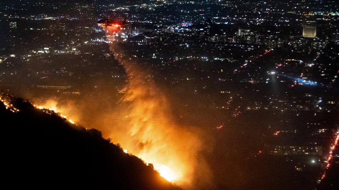  Firefighters battle to control devastating Los Angeles wildfires as ferocious winds calm somewhat 