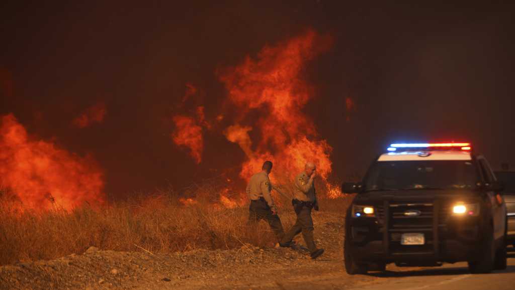  Firefighters battle to maintain the upper hand on a huge fire north of Los Angeles 