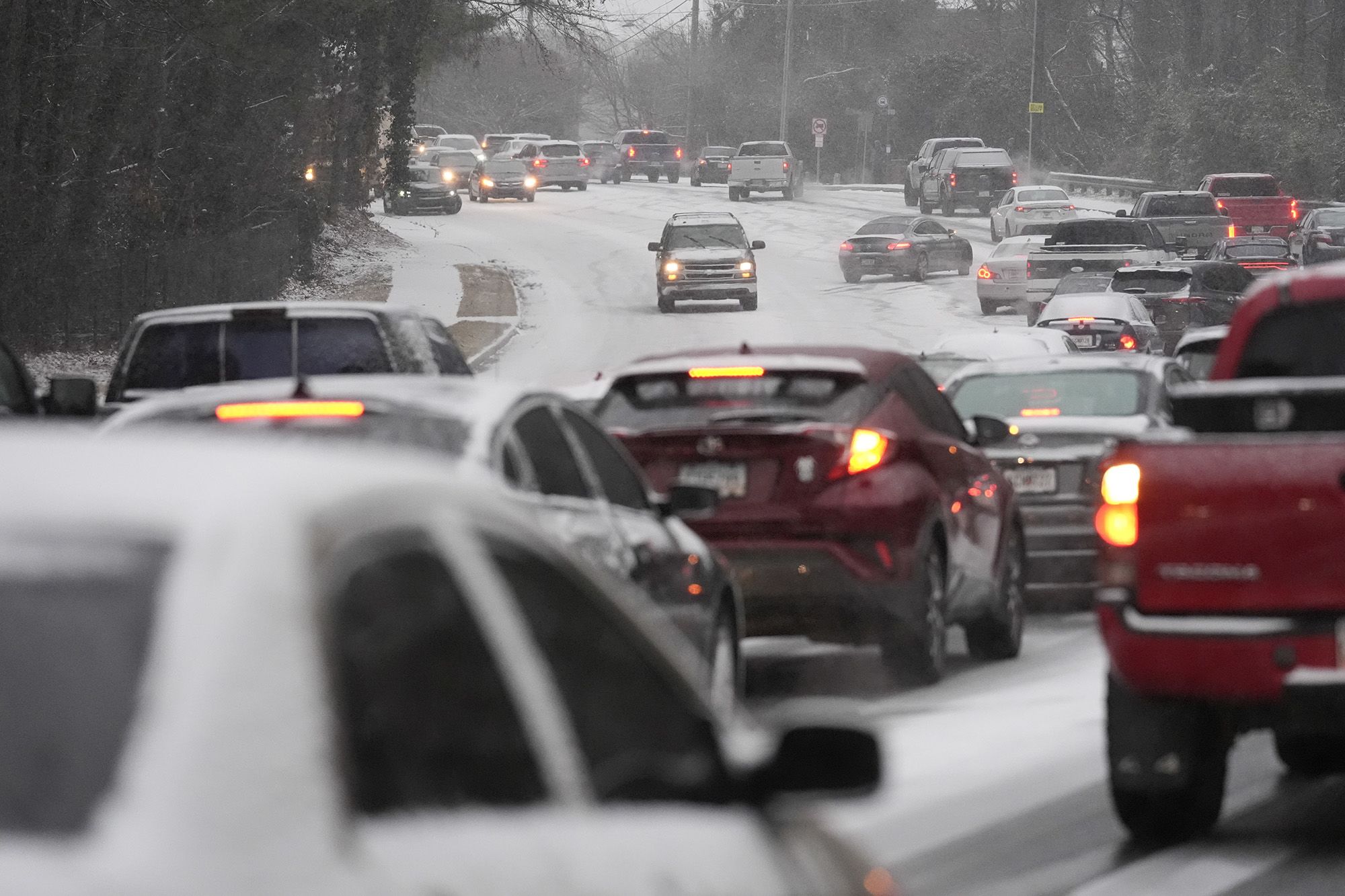  Icy roads pose dangerous threat in wake of massive winter storm that paralyzed Gulf Coast with record-breaking snow 