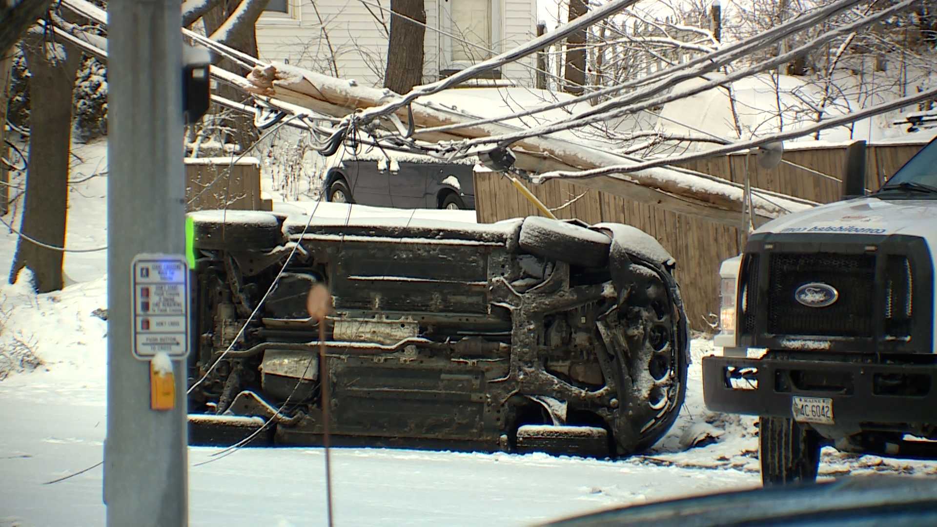  Vehicle winds up on its side after crashing into utility pole 