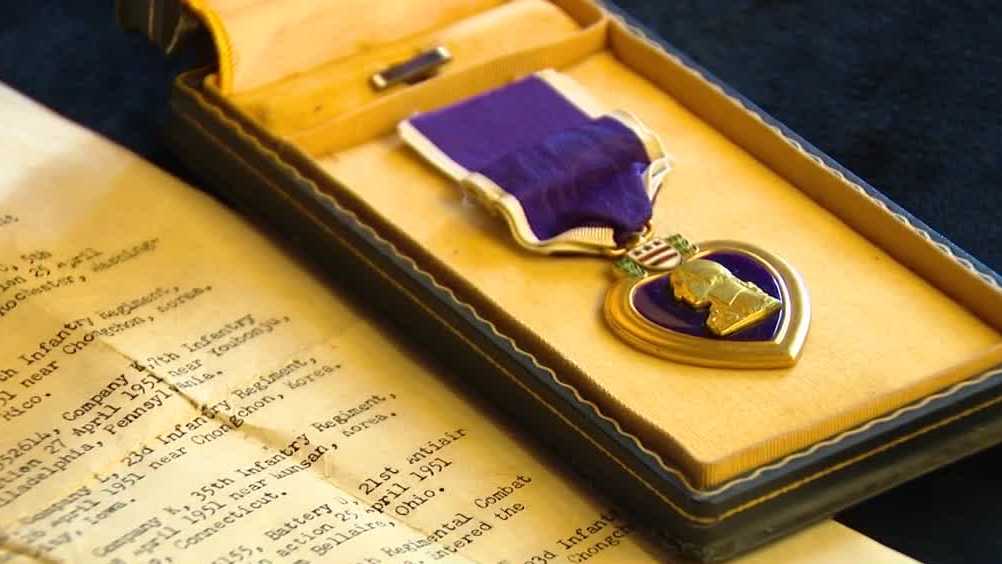  State Treasurer helps Iowa family reunite with veteran’s Purple Heart Medal 