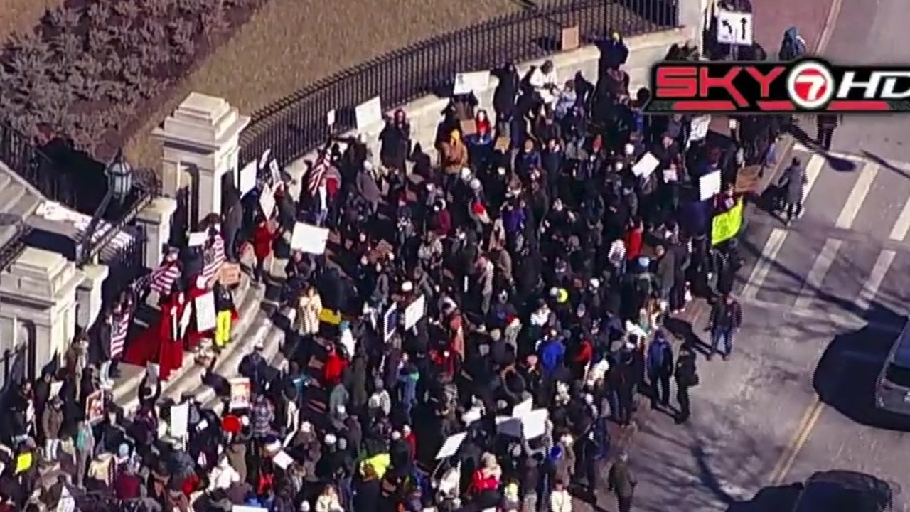  Crowd gathers at State House, marches through Boston Common in protest of President Trump 