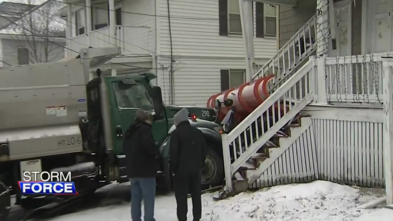  Snow plow slides off road, crashes into home in Lynn 