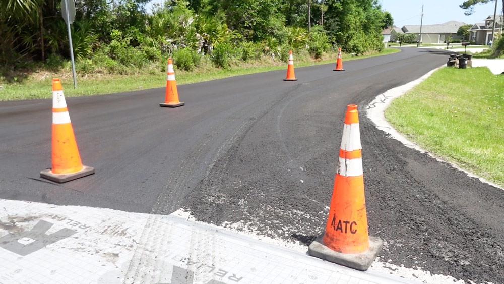   
																33 Palm Coast Streets Are Getting “Micro-Surfaced,” a Granular Sealant and Life-Extender Cheaper Than Regular Paving 
															 