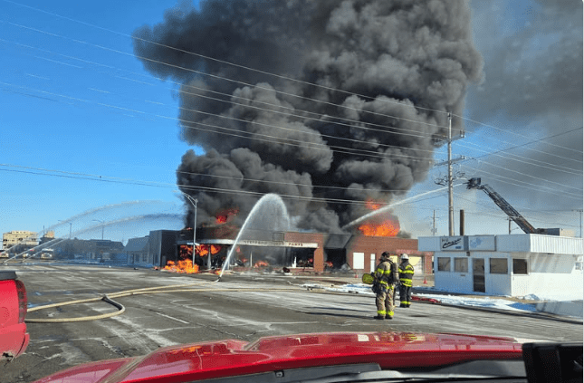   
																Building explodes in downtown Hutchinson, streets and sidewalks on fire 
															 