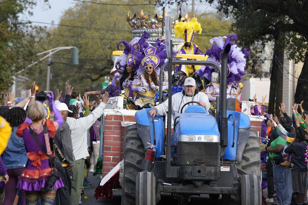  New Orleans celebrates Mardi Gras Day with costumes and revelry despite weather concerns 