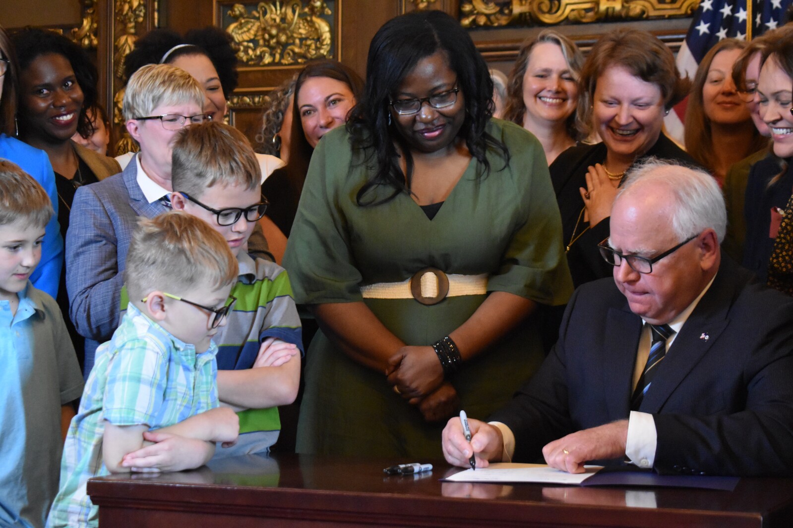  Walz enacts Minnesota paid family and medical leave plan 